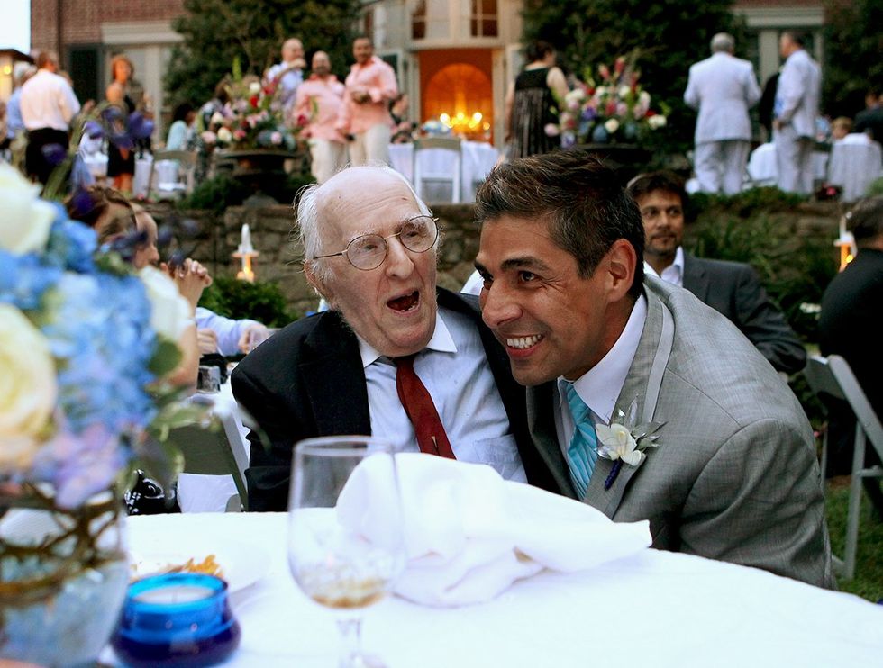 gay rights activist Frank Kameny with TV reporter Roby Chavez during Chavez Roe wedding reception