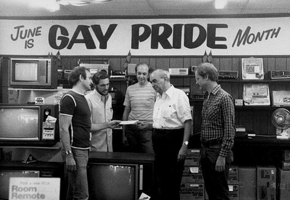 Gene Kittridge, owner of Gene's TV and longtime gay philanthropist, contributes money to Jim Kepner (second from right)