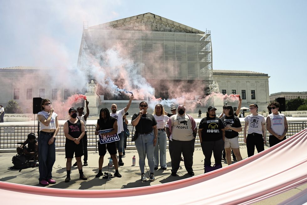 GLM activists set of trans flag smoke flares outside SCOTUS\u200b