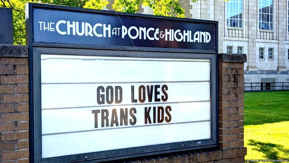 "God Loves Trans Kids" sign 