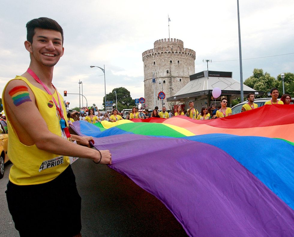 GREECE Thessaloniki 2015 participants carrying giant rainbow flag LGBTQ Pride Festival
