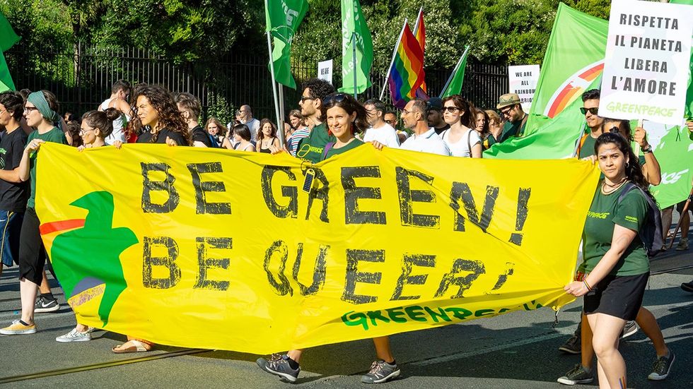 Greenpeace Queer climate change parade contingent lgbtq people rainbow flags