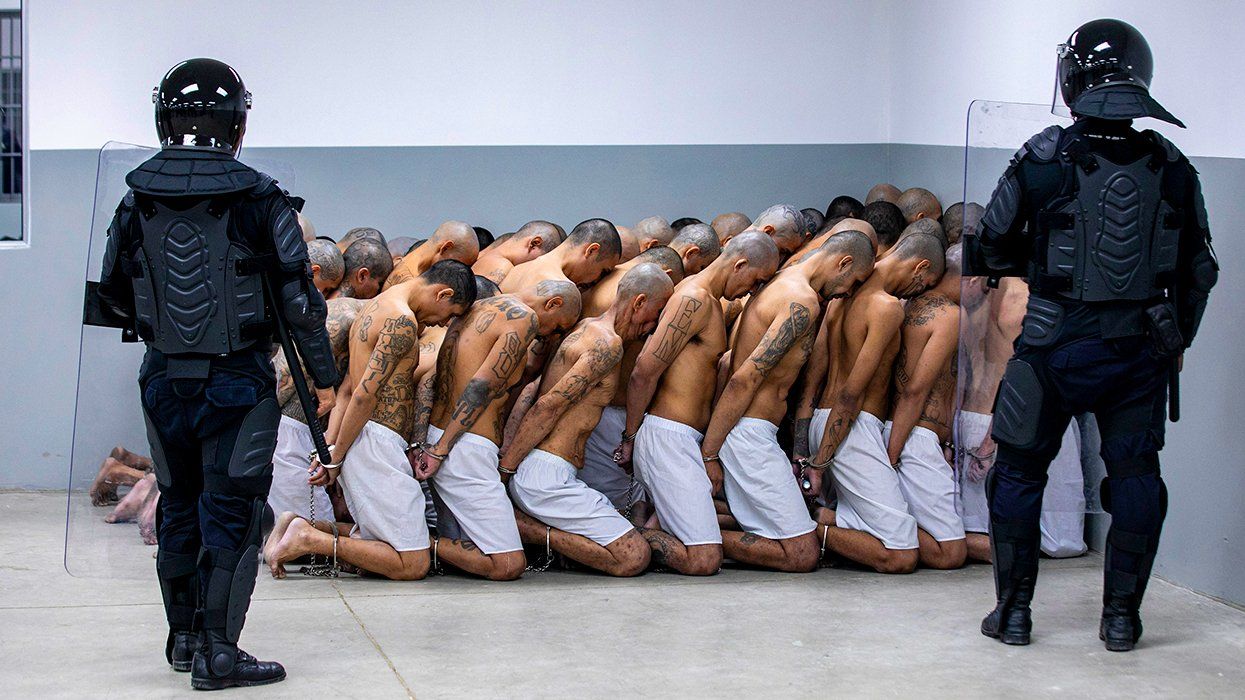 group of detainees moved to CECOT mega prison Terrorist Confinement Centre March 2023 Tecoluca El Salvador