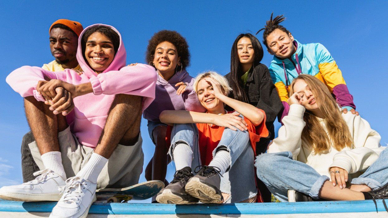 group of young people smiling and looking at the camera