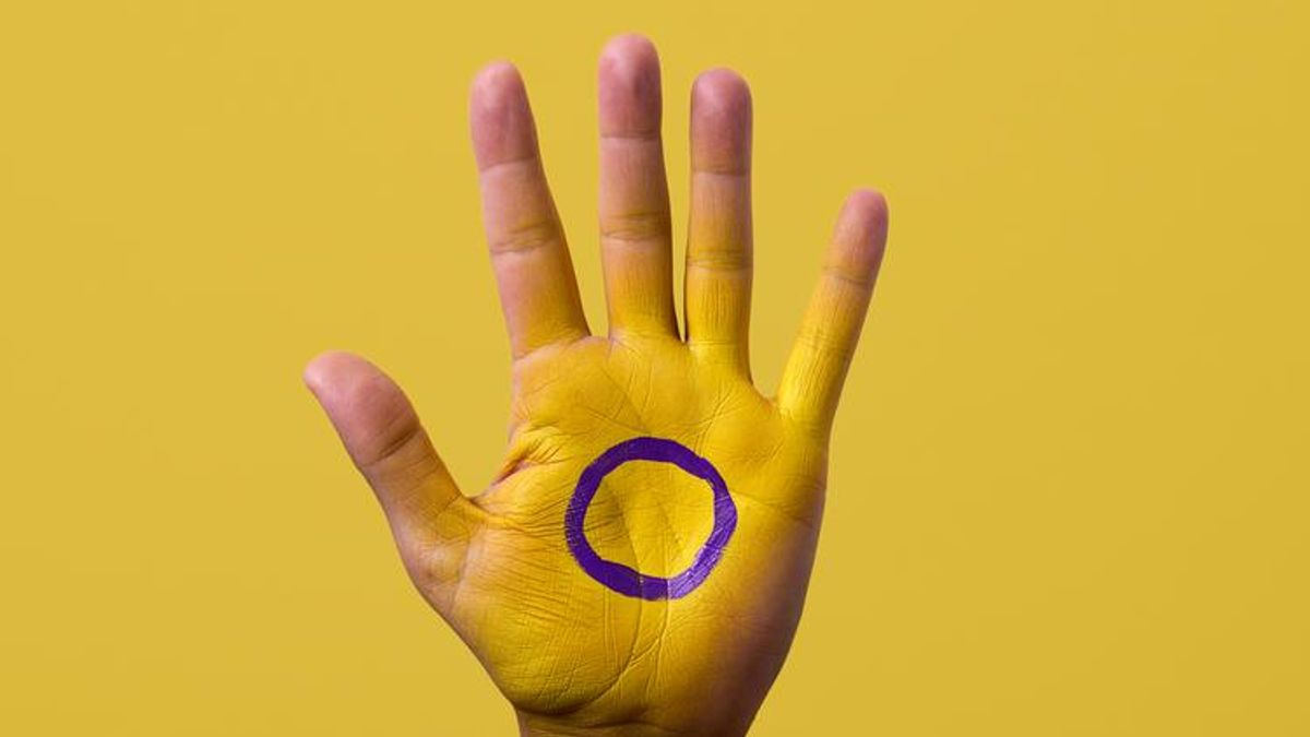 Hand with intersex flag on it