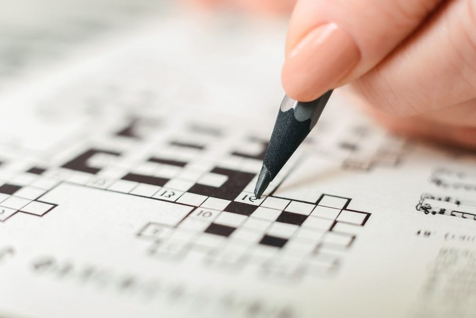 Hand writing in crossword puzzle