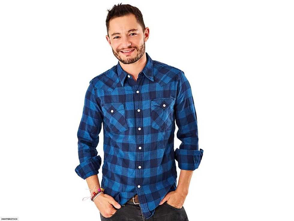 handsome man blue and black flannel jeans white background