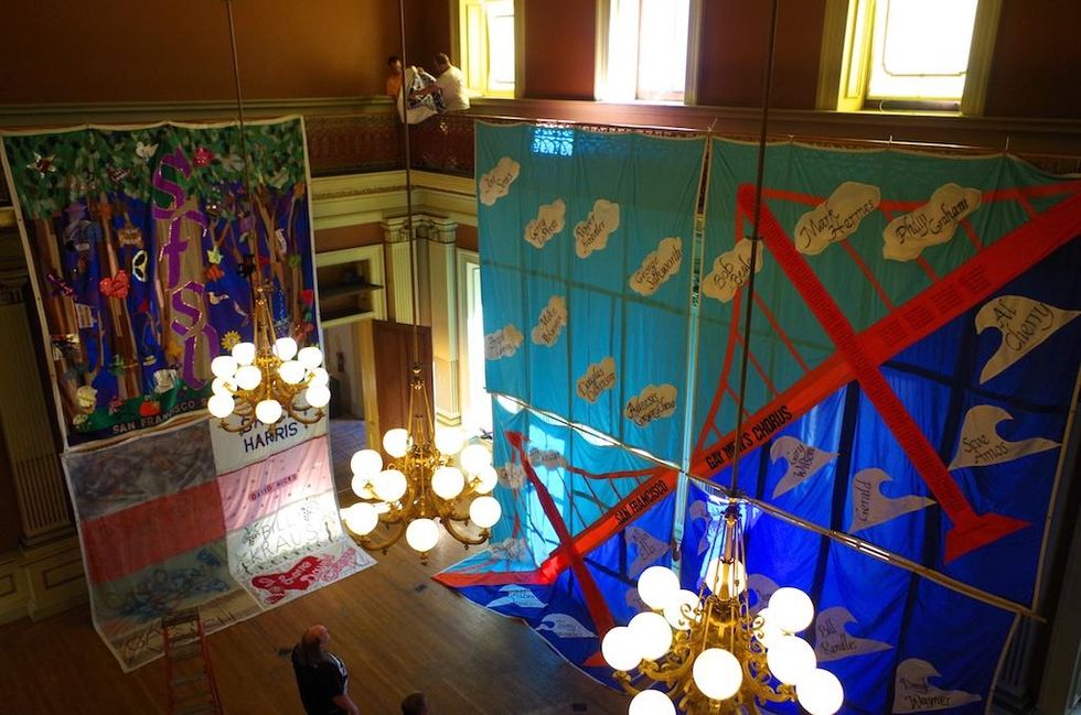 Hanging the aids quilt in the historic old mint
