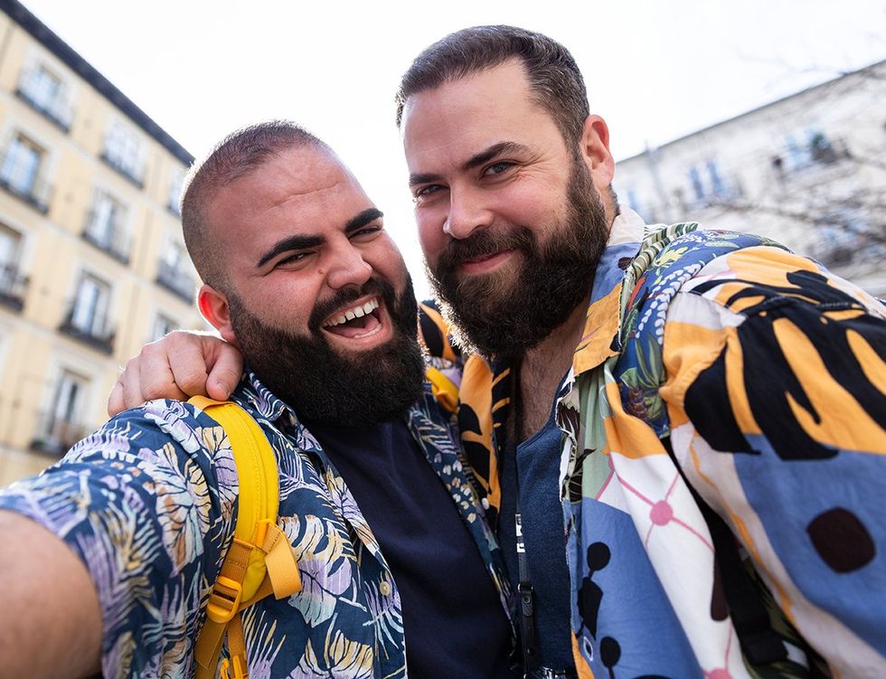 happy men taking selfie on vacation