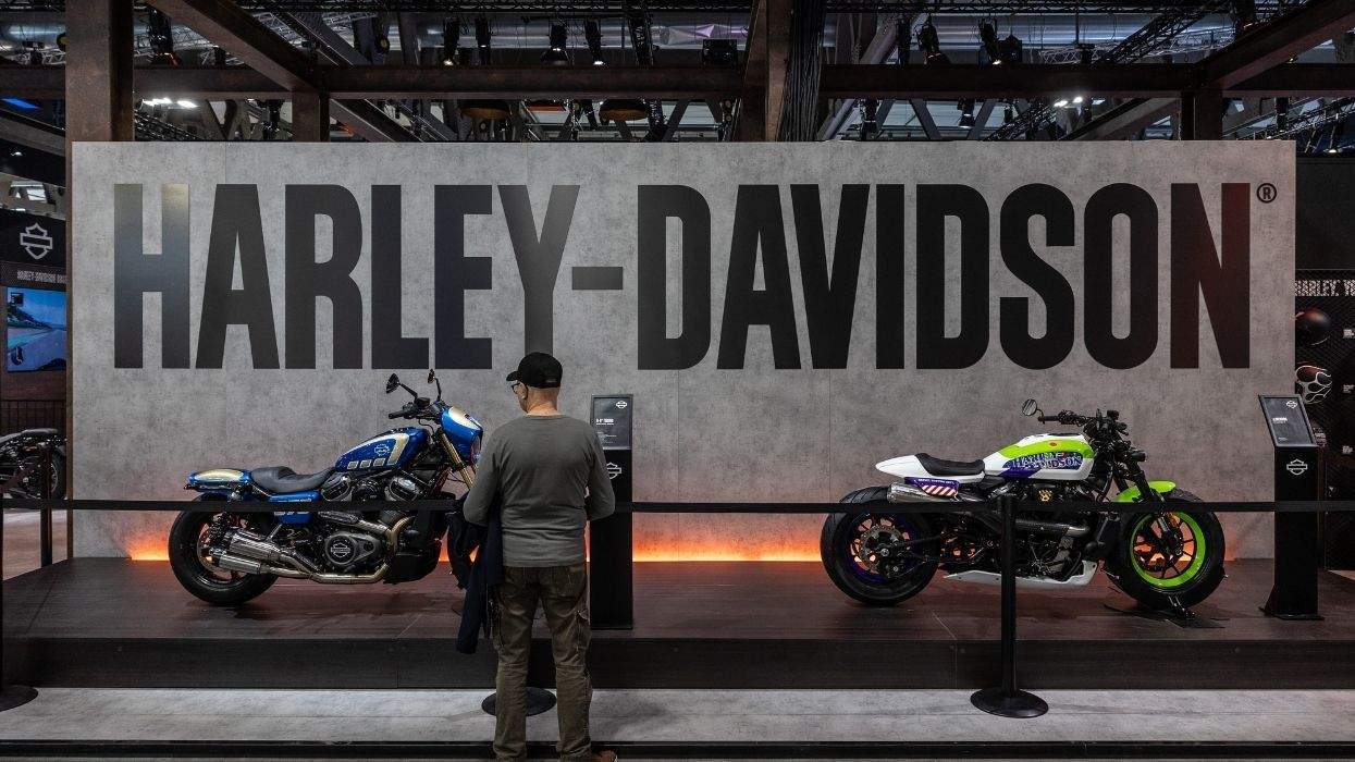 harley-davidson display with two motorcycles and a man looking at them
