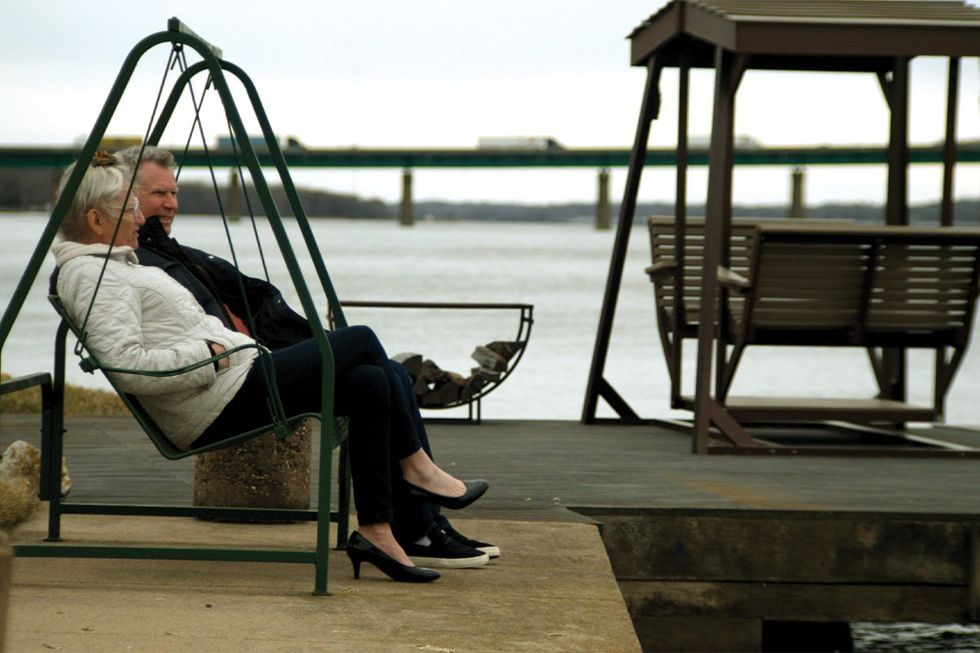 Harper Steele and Will Ferrell on a dock looking out into the water