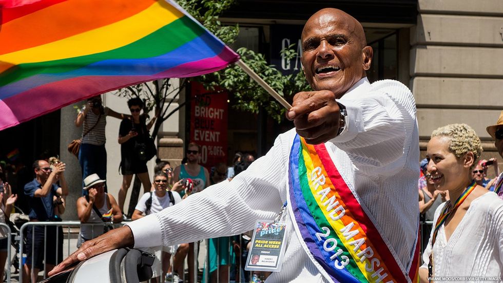 Harry Belafonte at NYC Pride 2013 waving a Pride flag
