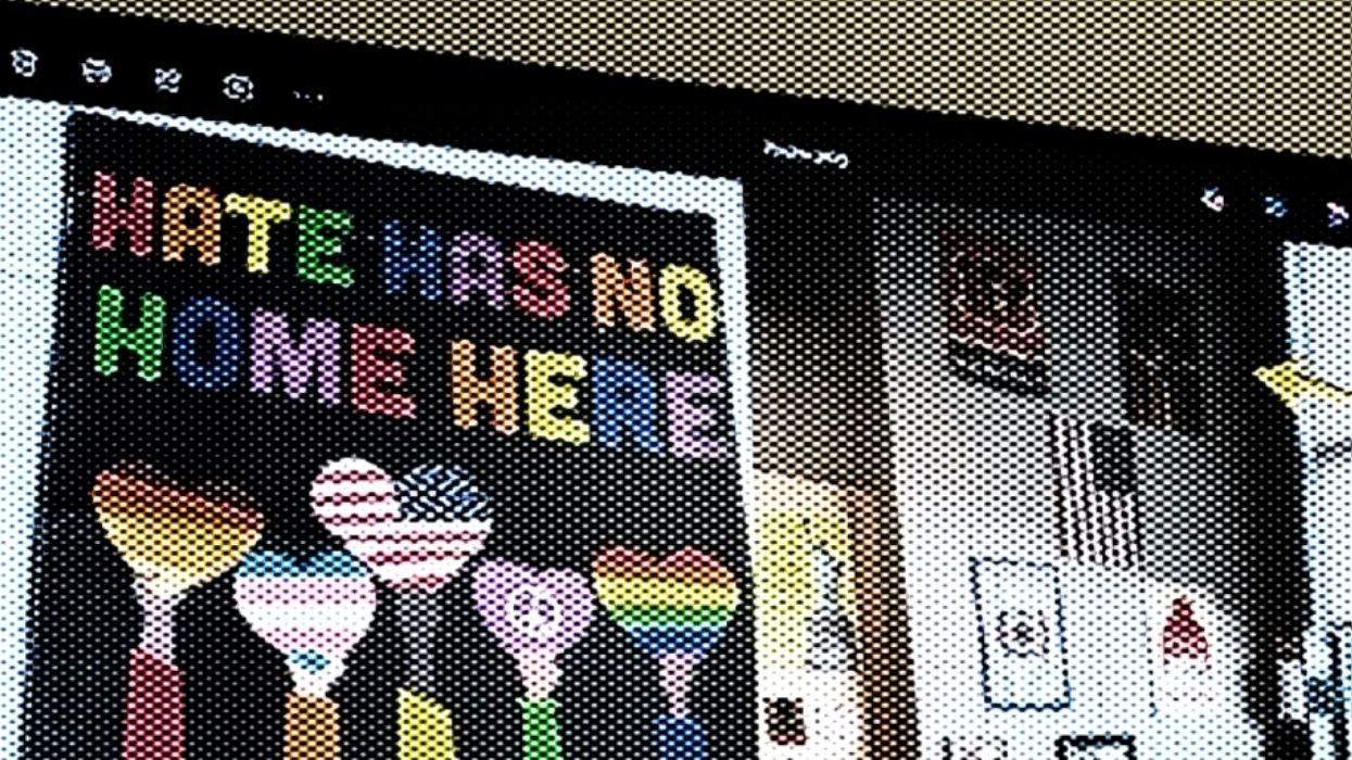 hate has no home here sign with five hearts representing different identities.