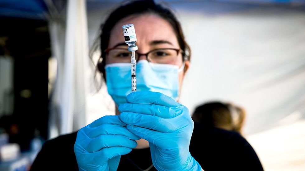 health care worker syringle vial dose Jynneos mpox smallpox monkeypox vaccine clinic Long Beach City College California