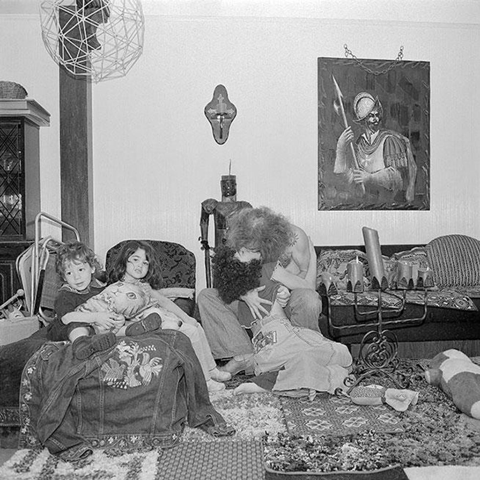 Hippieish Parents Kiss, Bethpage, NY September 1975