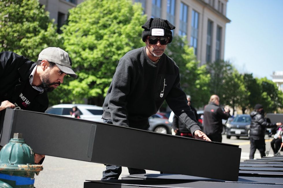 HIV and AIDS activists hold coffin delivery to protest PEPFAR cuts at State Department building in Washington, D.C., April 17, 2025