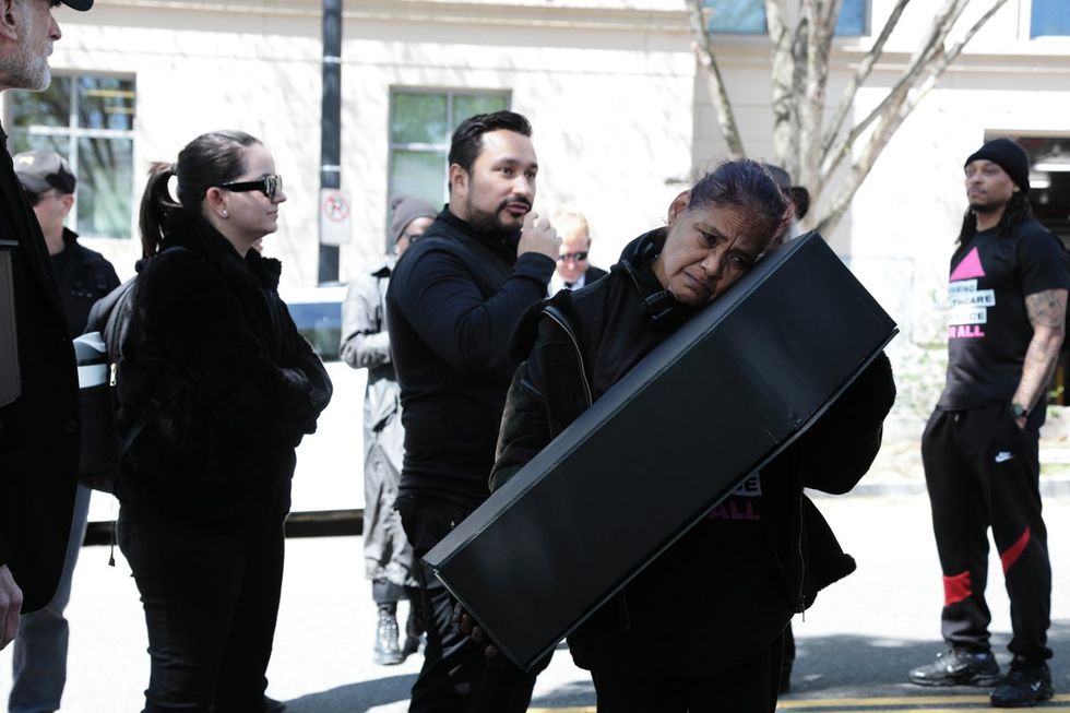 HIV and AIDS activists hold coffin delivery to protest PEPFAR cuts at State Department building in Washington, D.C., April 17, 2025