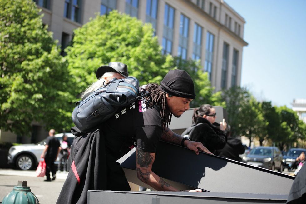 HIV and AIDS activists hold coffin delivery to protest PEPFAR cuts at State Department building in Washington, D.C., April 17, 2025