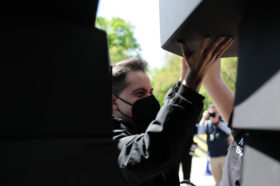 HIV and AIDS activists hold coffin delivery to protest PEPFAR cuts at State Department building in Washington, D.C., April 17, 2025