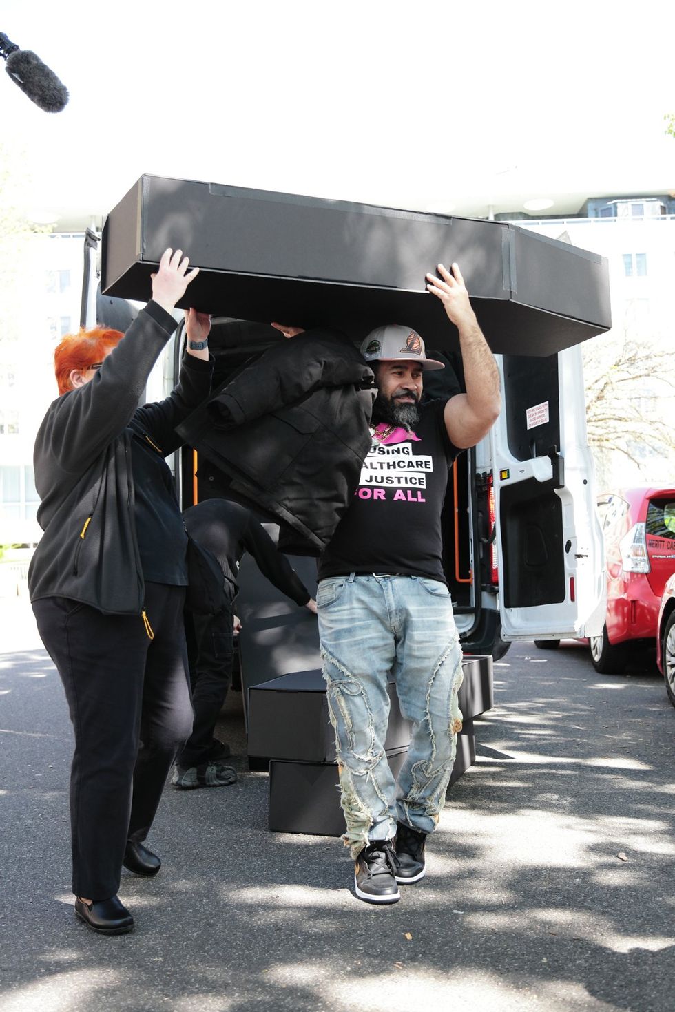 HIV and AIDS activists hold coffin delivery to protest PEPFAR cuts at State Department building in Washington, D.C., April 17, 2025