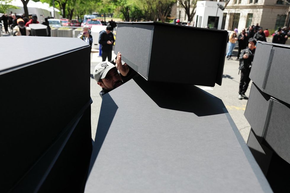 HIV and AIDS activists hold coffin delivery to protest PEPFAR cuts at State Department building in Washington, D.C., April 17, 2025