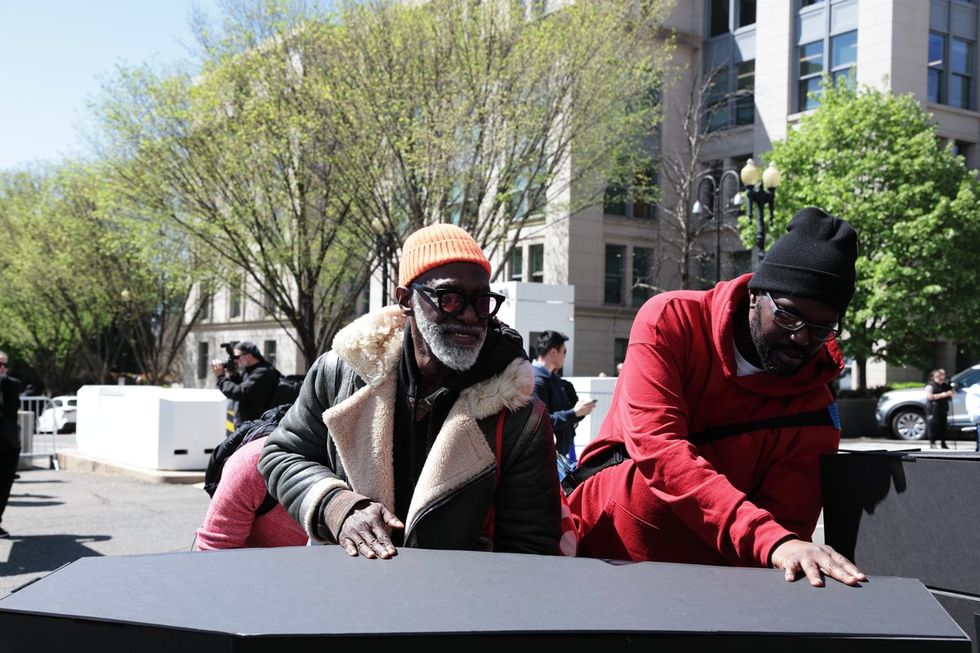 HIV and AIDS activists hold coffin delivery to protest PEPFAR cuts at State Department building in Washington, D.C., April 17, 2025