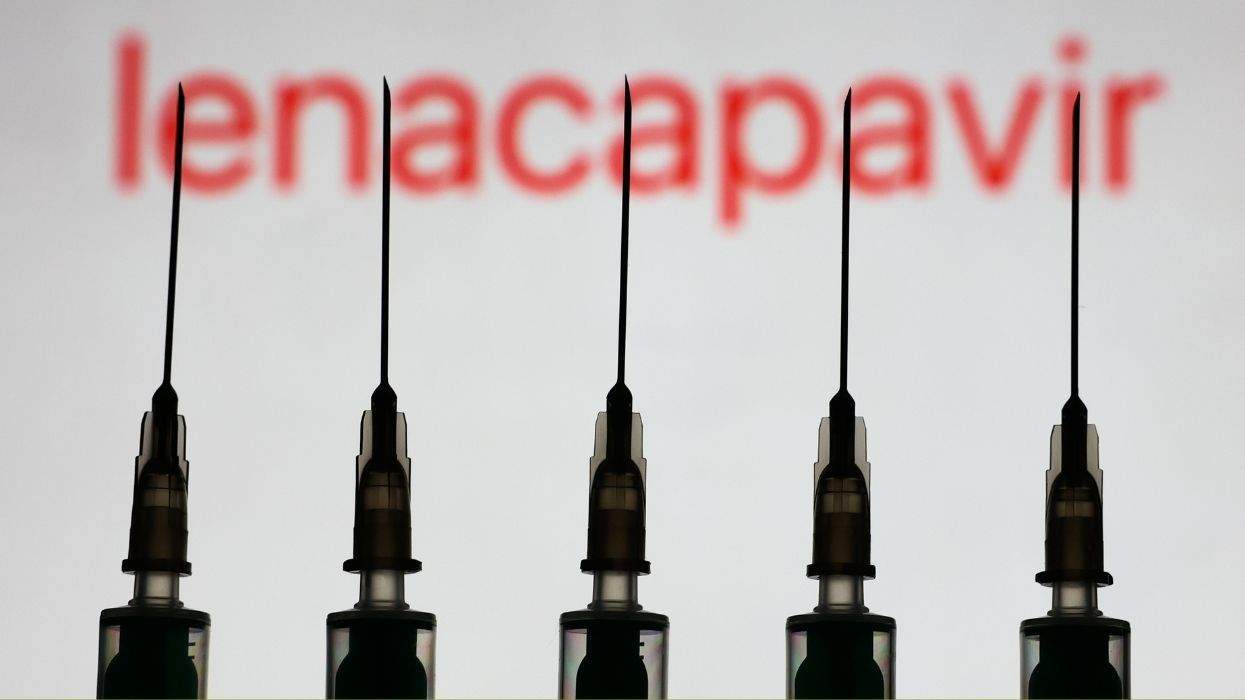 hiv medication lenacapavir displayed on a wall behind five syringes with needles
