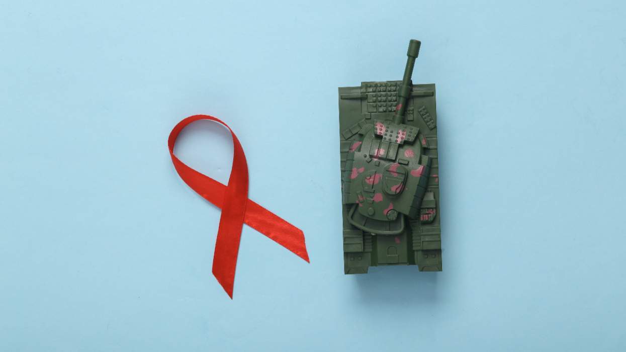 HIV red ribbon with toy tank
