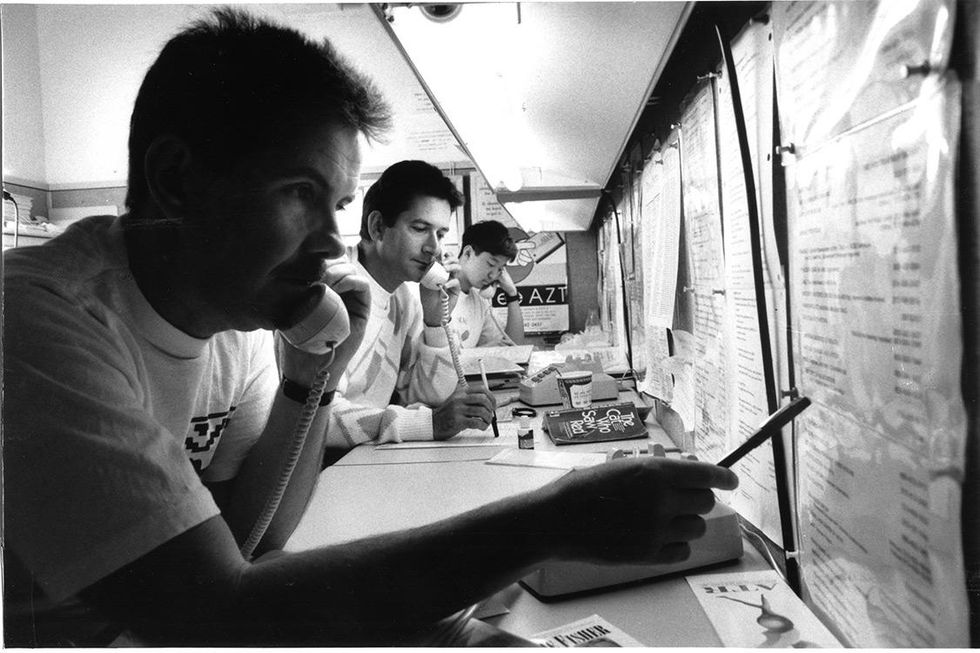 Hotline volunteers answer calls. The Hotline was GMHC\u2019s first service.