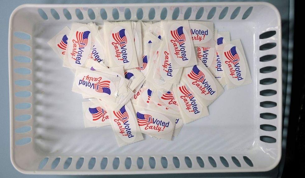 i voted early stickers in a basket