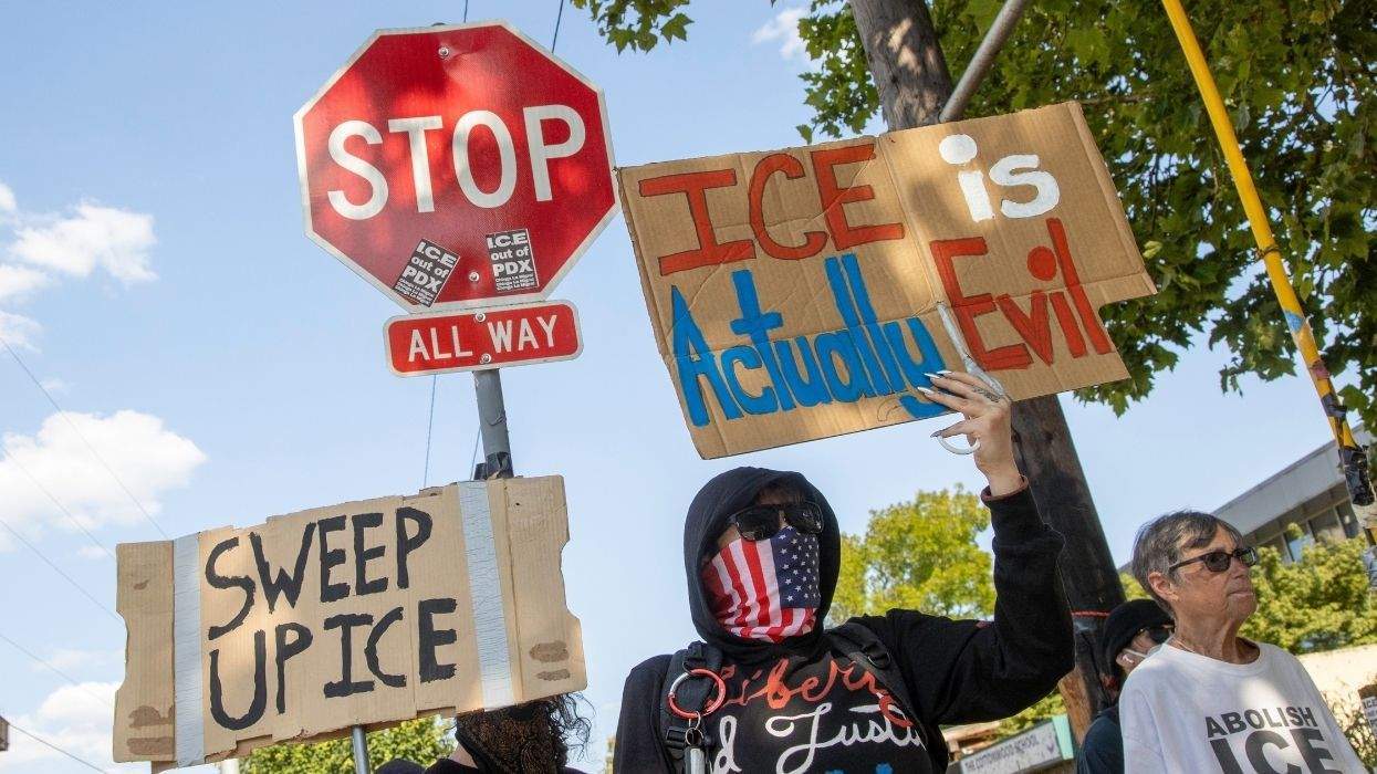 ice is actually evil sign held by protester
