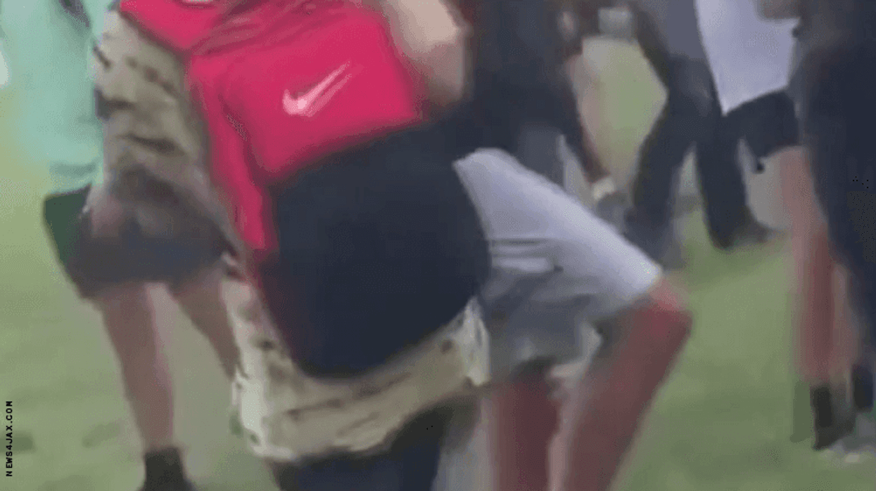 Image from video showing students yelling anti-LGBTQ+ slurs.