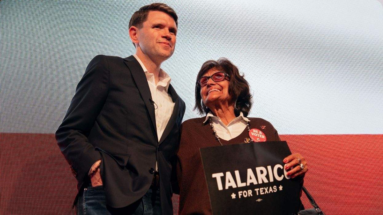 james talarico with a supporter holding a talarico for texas sign