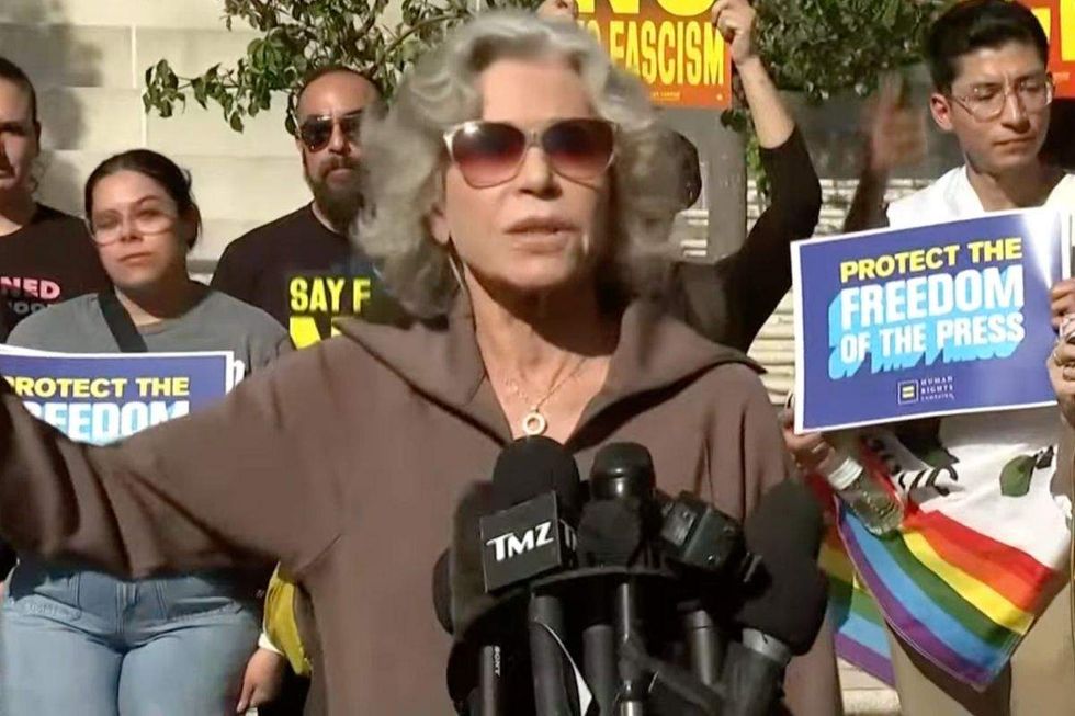 jane fonda hrc signs reading protect the freedom of the press