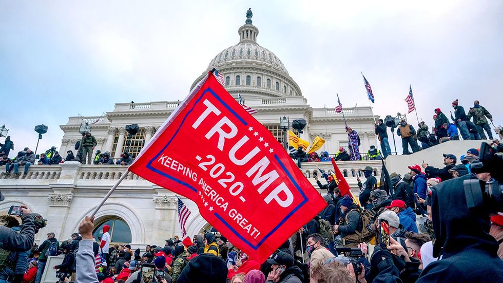 January 6th insurrection attack us capitol trump flag