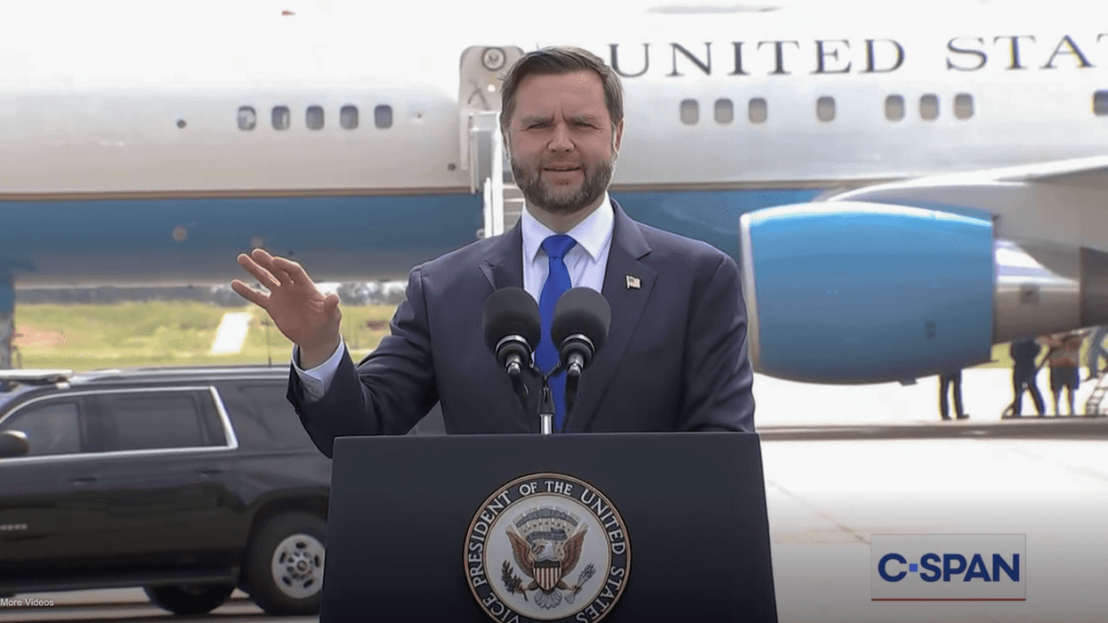 JD Vance in front of an airplane