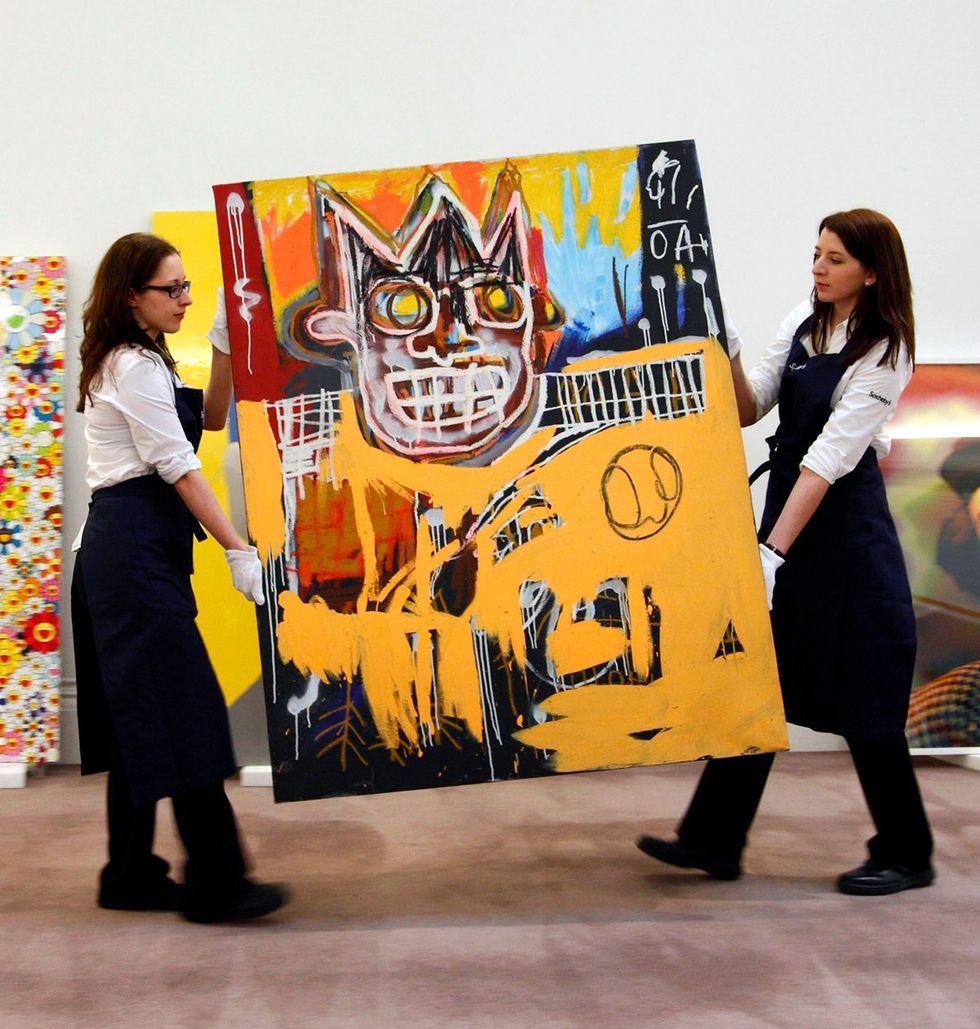 Jean Michel Basquiat painting entitled Orange Sports Figure 1982 being prepared for Sothebys Auction House Impressionist Modern Art sale London England