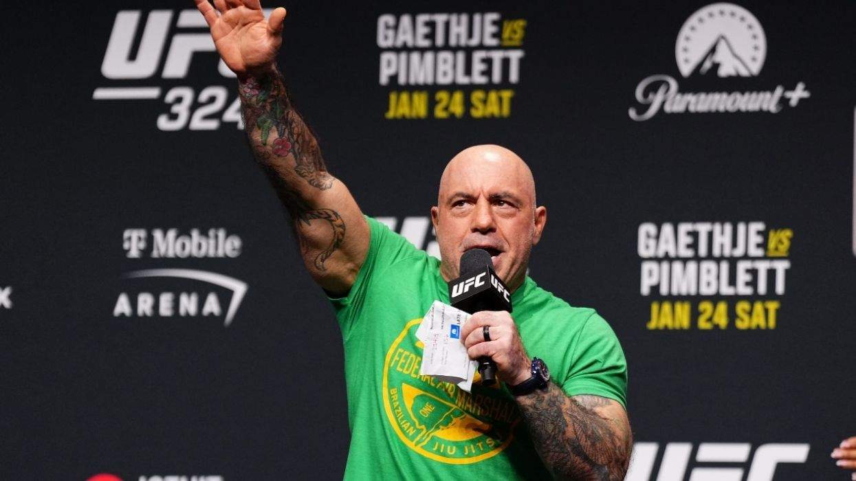 joe rogan speaking into a microphone with the ufc logo