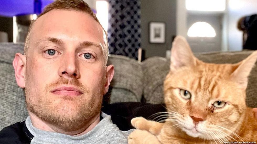 Josh Kruger with cat