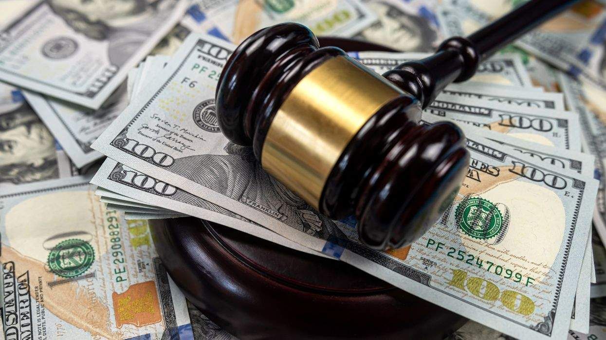 judges gavel on american money 100 dollar bills