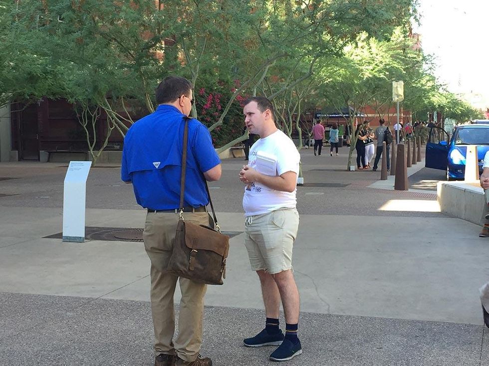 Justin Massey (right), organizing director for Equality California, canvasses at the convention.