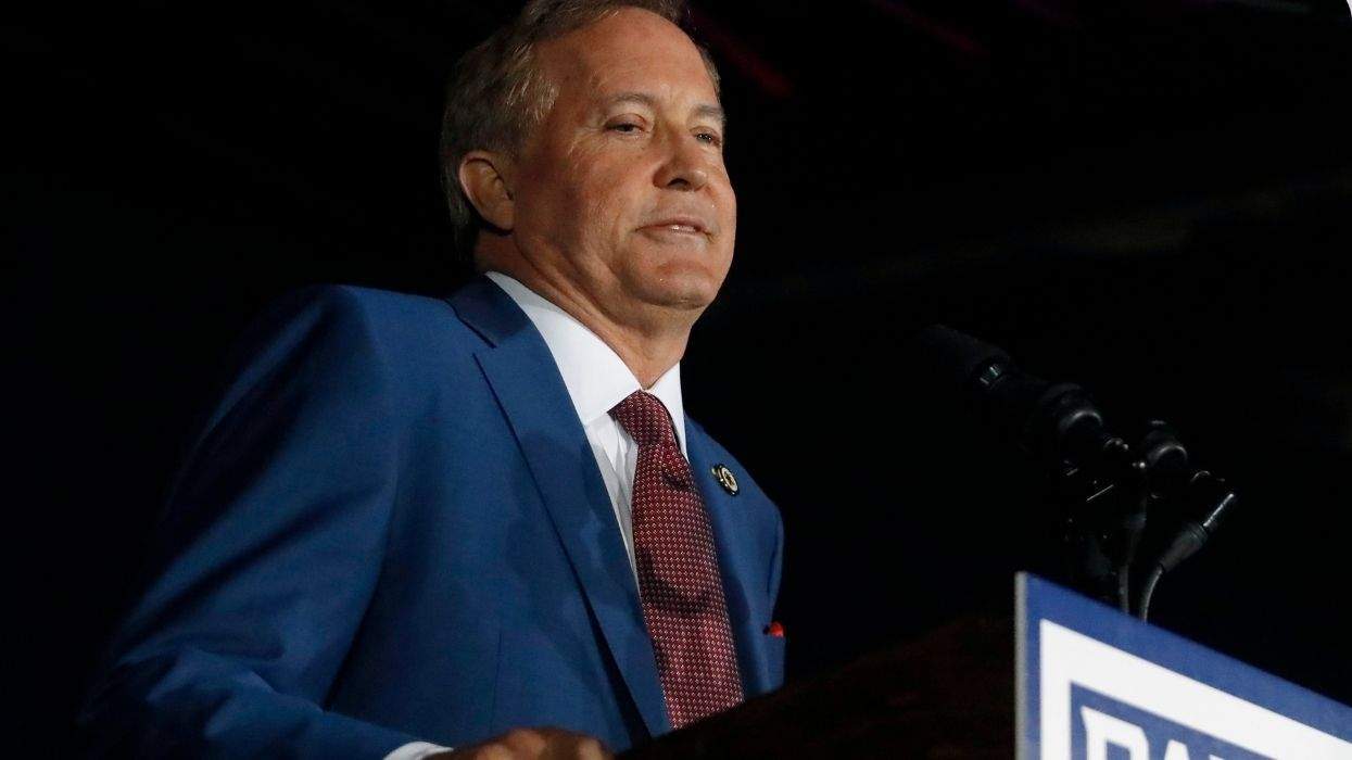 ken paxton speaking at a lectern