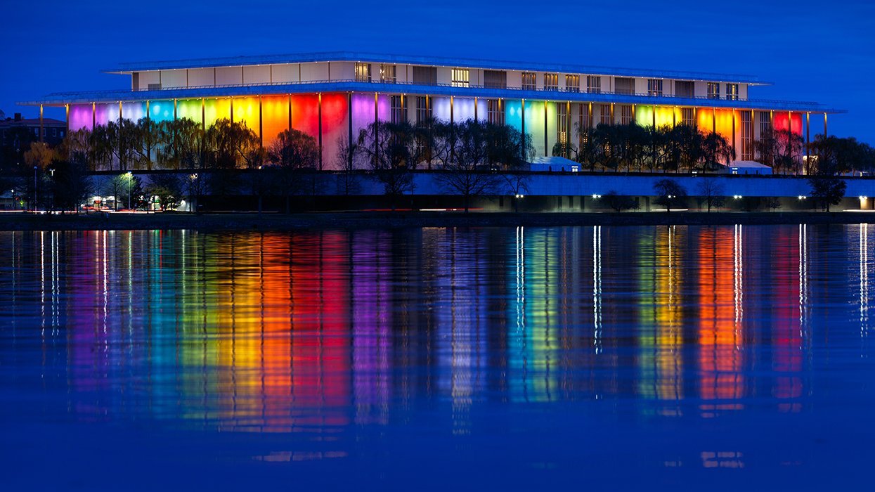 Kennedy Center with rainbow lights reflecting off the water