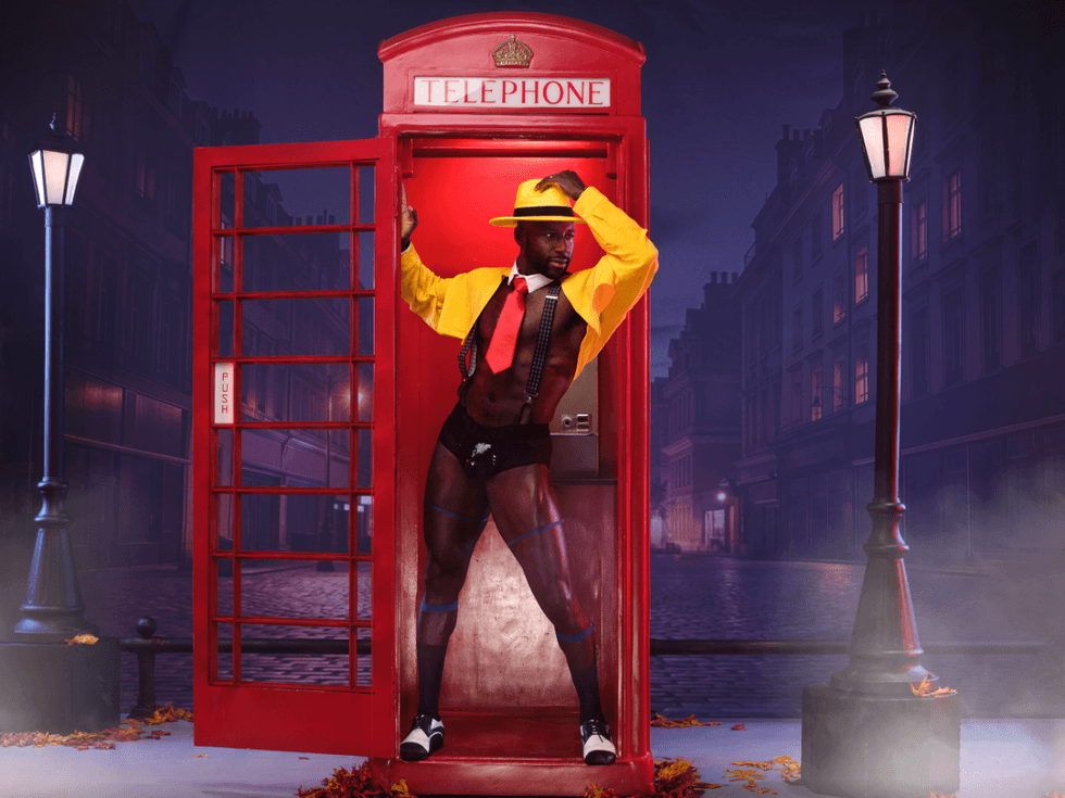Cassan Brailsford poses inside a red phone booth in London as Dick Tracy, wearing a bright yellow hat and coat and red tie, against a foggy night street background