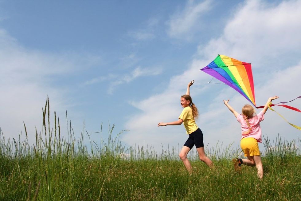 Kids with rainbow kite