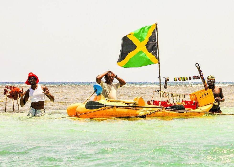 Kingston Jamaica Local vendors selling souvenirs directly from boats on the sea