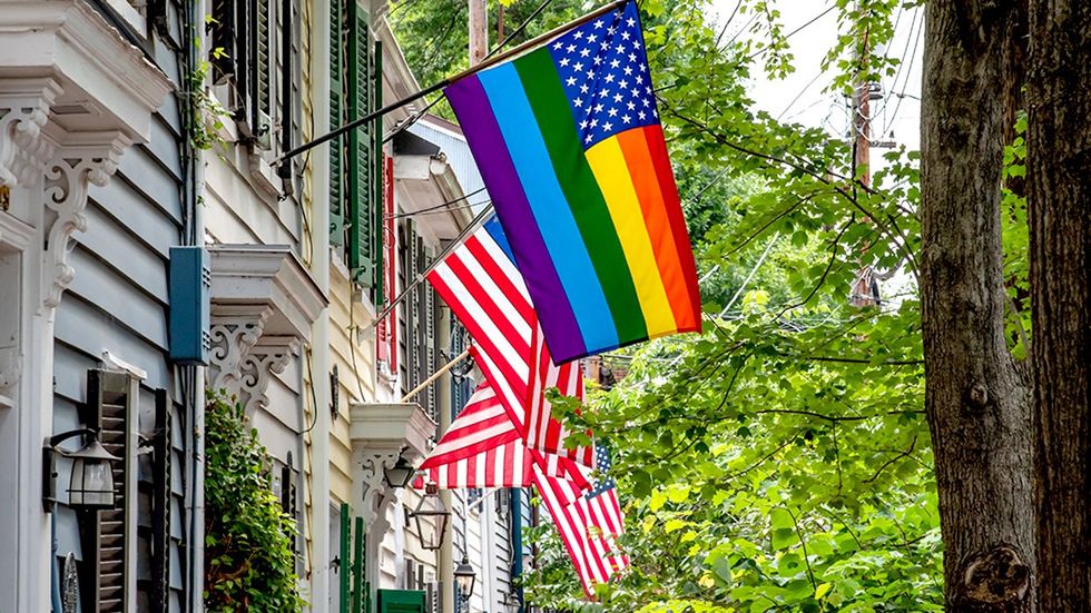 LGBTQ American Flags Flying Front Door Homes