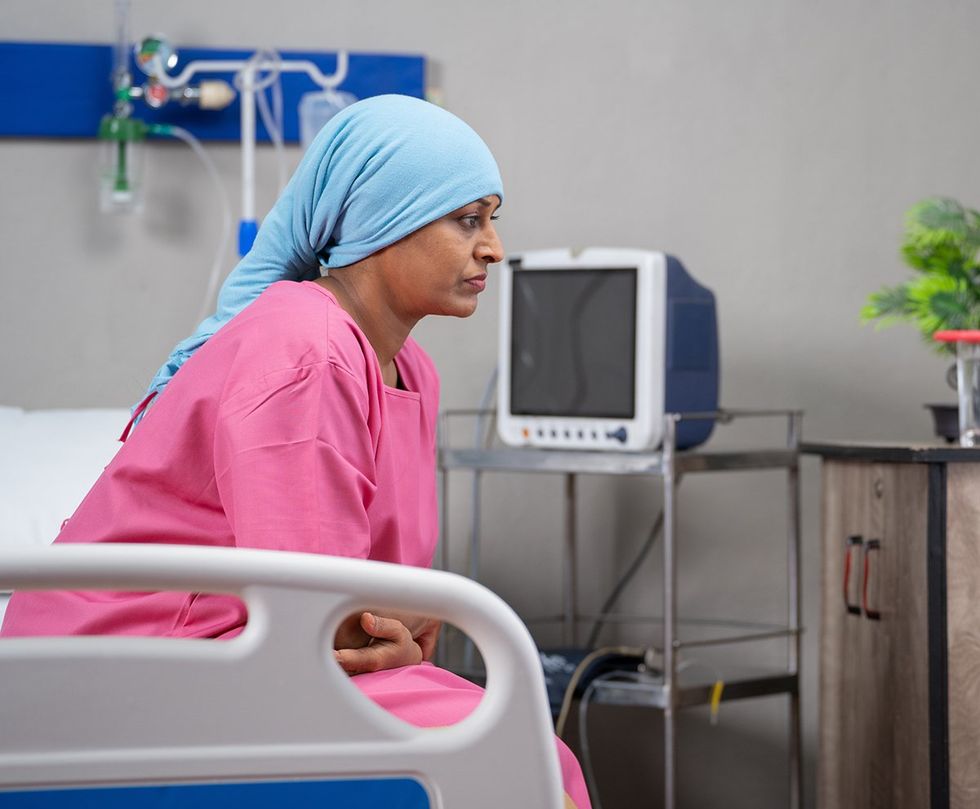 LGBTQ POC cancer patient sick hospital bed