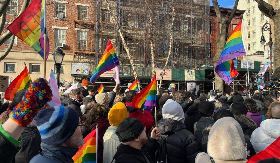 lgbtq pride flags and onlooke