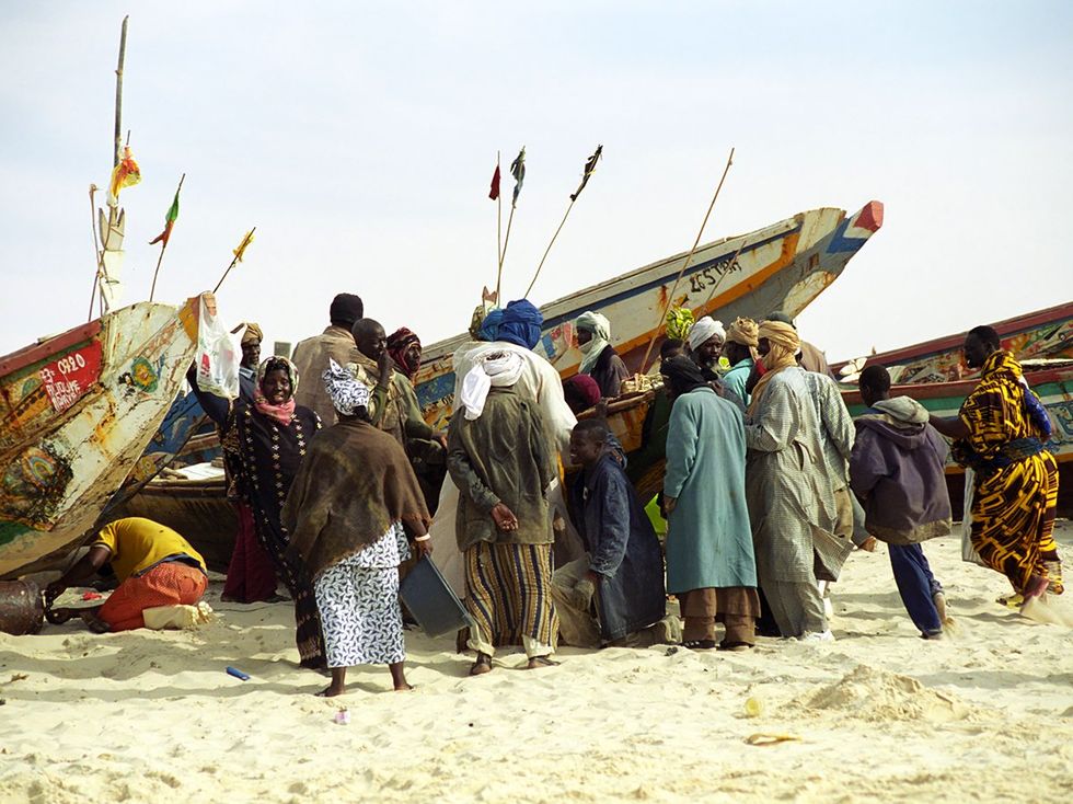 Local fishermen sell their daily catch on the beach in Nouakchott Mauritania
